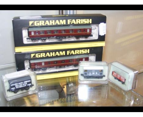 A boxed Graham Farish N gauge coach and one other, together with three wagons 
