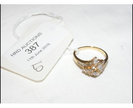 An attractive diamond 'star burst' ring in 18ct gold setting CONDITION REPORT3.8g