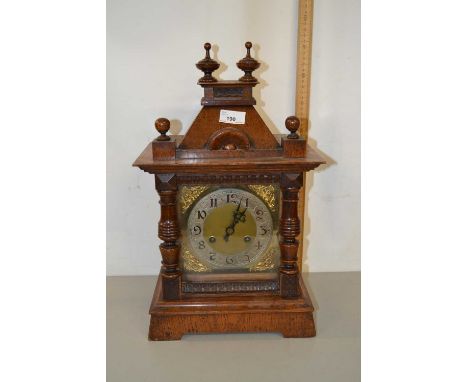 Late 19th Century continental mantel clock with brass movement striking on a coiled gong set in an architectural case