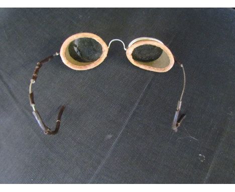 A pair of vintage car goggles