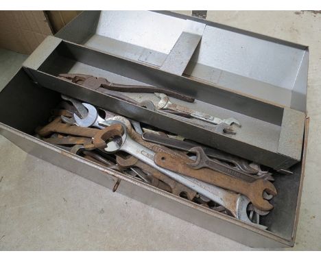 A box of mixed tools including spanners 