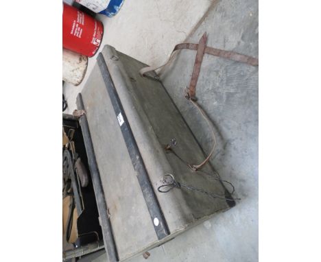 A small vintage car trunk with key 