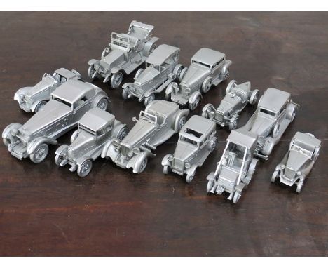A quantity of Danbury mint pewter model vintage cars 