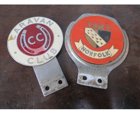 A Norfolk car badge stamped with a crown and an R to base and an enamelled caravan club badge 