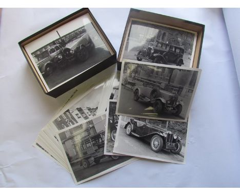 Two boxes of historical black and white photographs of various vintage and classic vehicles 