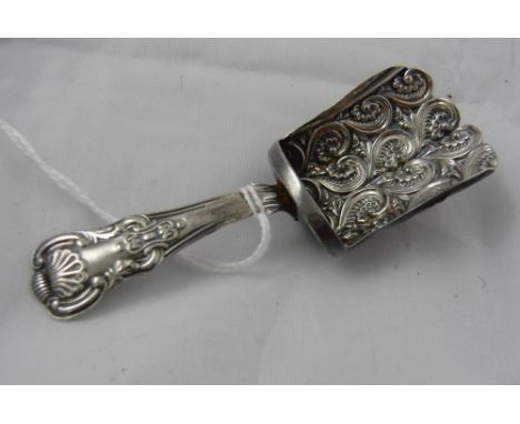 An embossed silver caddy spoon, repair to rear of stem