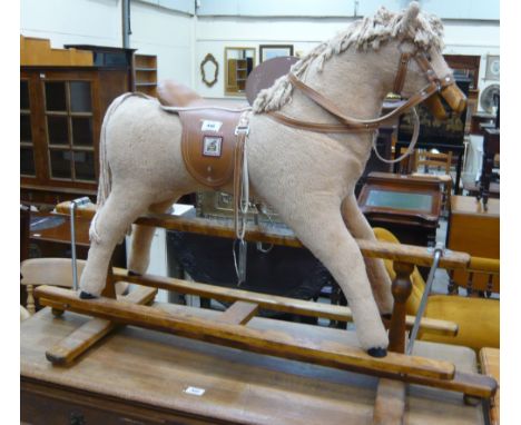 A plush Mamas and Papas rocking horse on H stand