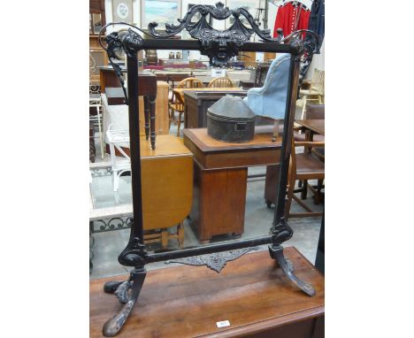 A Victorian moulded brass mirrored firescreen on splayed feet, 92cm high