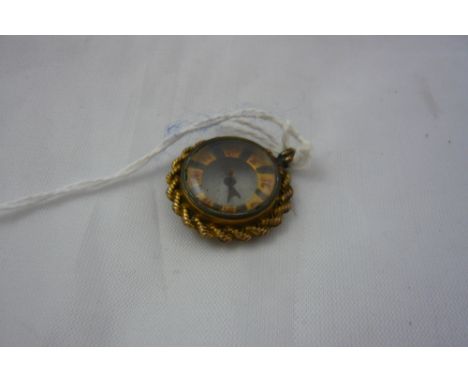 A compass with weather terminals in yellow metal