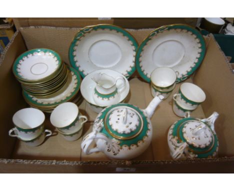 A green and white gilt highlighted tea service