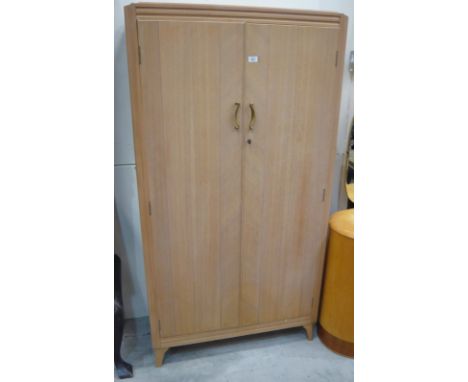 A modern Lebus two door wardrobe with fitted shelf and drawer interior, 93cm x 46cm x 174cm high