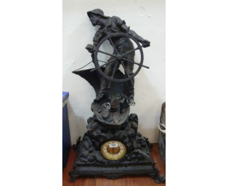 A figural mantel clock with Sailor aboard boat and fish and bird base (af)