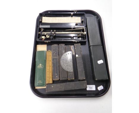 A tray containing cut throat razors, Rabone folding wooden ruler, a slide rule in case, a Bakelite cased Allbrit precision pl