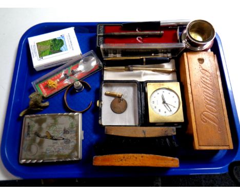 A tray containing miscellaneous to include stirrup cup in case, silver mechanical pencil, assorted pens to include a fountain