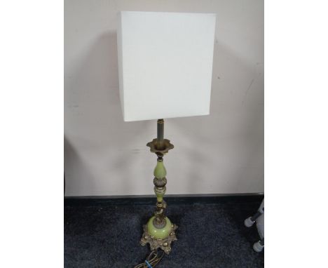 A brass and onyx effect figural table lamp with shade 