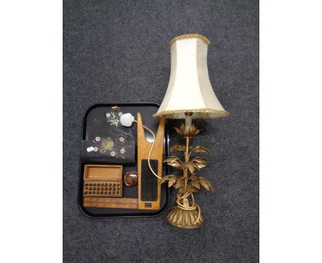 A tray containing antique brass table lamp with shade in the form of a plant, a folding boxwood ruler, papier mache letter ra