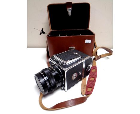 A vintage Kiev 80 camera with lens in a fitted leather case 