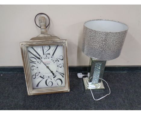 A contemporary mirrored table lamp with shade together with a retro style French wall clock 