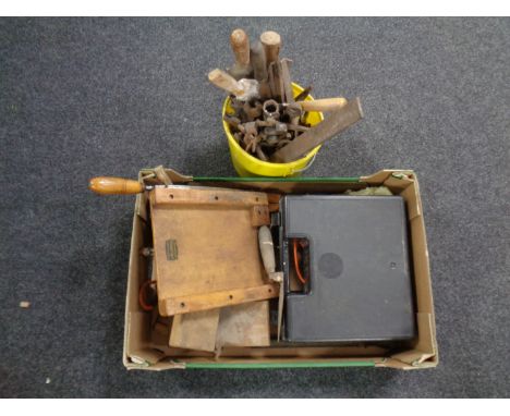 A bucket containing vintage hand tools together with a further box containing spirit level 