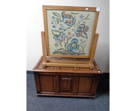 An oak blanket box together with a tapestry fire screen 