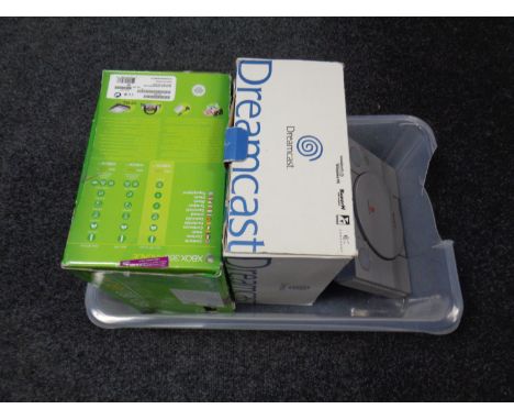 A boxed XBox 360 console together with a boxed Dreamcast console and a PlayStation (as found) 