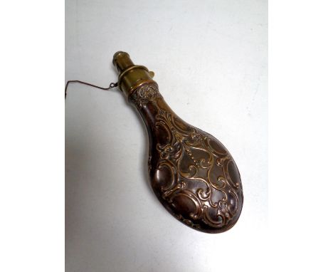 A 19th century copper and brass embossed shot flask by G &amp; JW Hawksley (spring a/f)