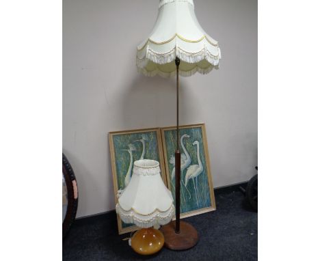A 1970s teak and brass standard lamp with shade, together with a 1970s glass table lamp with shade and two framed prints  