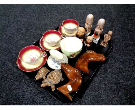 A tray containing miscellaneous ceramics to include Wade tortoises, Aynsley china teacups and saucers, Goebel monk, preserve 