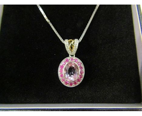 A 14ct zunzite, ruby and diamond pendant with 9ct box chain