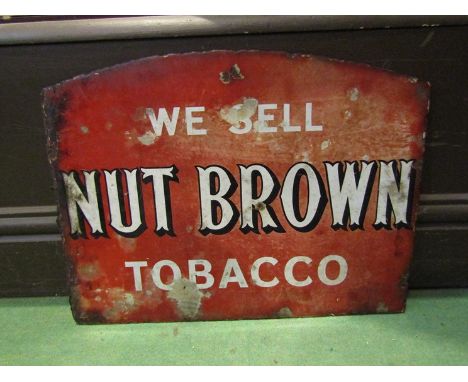 An enamel sign; We Sell Nut Brown Tobacco, 34cm x 45cm