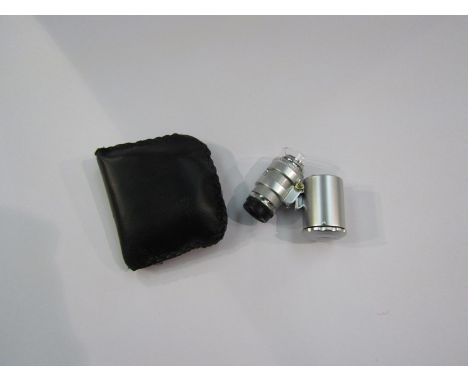 A 60x pocket microscope/magnifier with UV light, cased