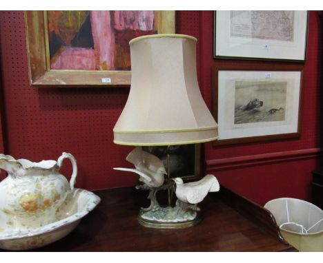 A figural lamp of doves on a branch surmounted with base, with shade