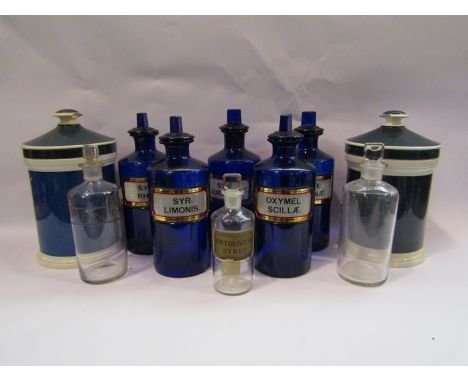 Five blue glass apothecary bottles, three clear glass examples and two ceramic lidded canisters 