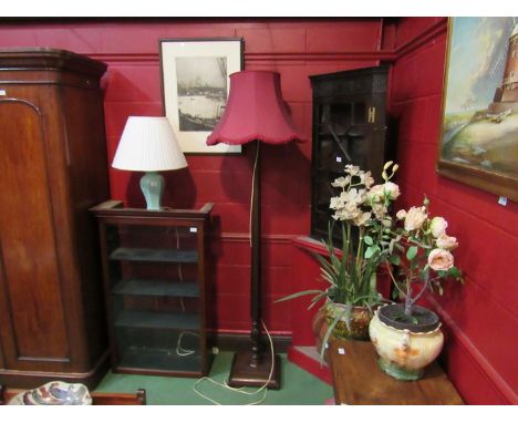 A 1930's mahogany standard lamp with faceted column and shade