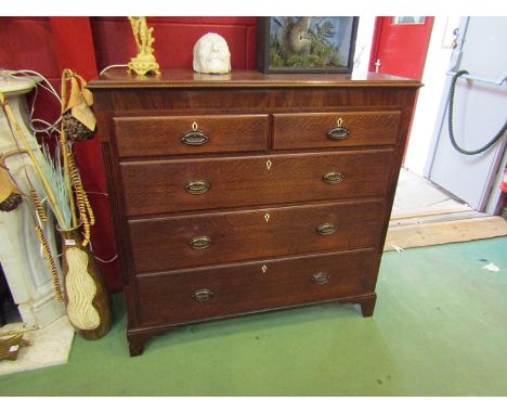 A George III north country mahogany inlaid oak chest of two short over three graduating long drawers on bracket feet, 118cm t