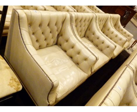 LEATHER ARM CHAIRS. Four Kingstage cream leather button back arm chairs, option on next lot