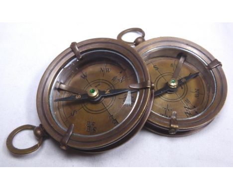 BRASS COMPASSES. Two brass compasses marked Dolland of London, D: 7 cm