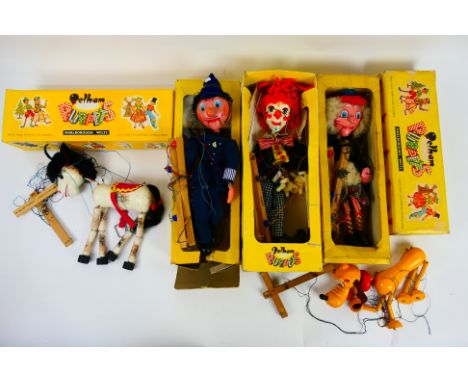 Pelham Puppets - Five boxed standard Pelham Puppets. Lot includes Bimbo; MacBoozle; Pluto and similar. Puppets all show age a