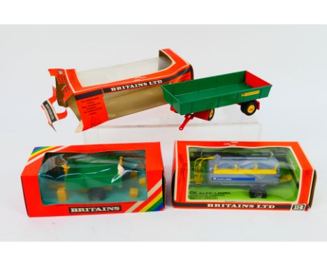 Britains - Three boxed Britains farm implements. Lot consists of Britains #9558 8 Wheeled Trailer; #9560 Vacuum Tanker; and 9