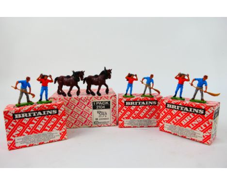 Britains - A group of four Britains Trade Packs. Lot consists of Britains #2104 Clydesdales, together with #2058 Assorted Lab