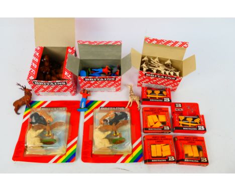 Britains - A mixed collection of boxed Britains plastic figures and accessories. Lot consists of two sealed packs of Zoo anim