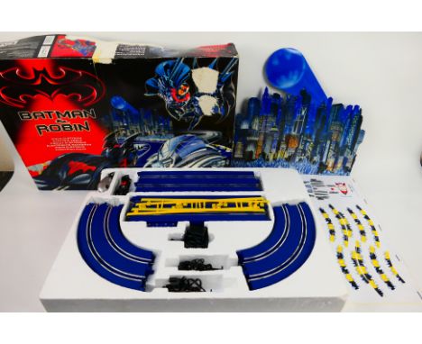 Polistil - A boxed Polistil 'Batman & Robin' electric slot car set. The set includes 2 cars, track, transformer 2 hand contro