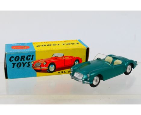 Corgi - A boxed MGA Roadster in green with shaped wheel hubs # 302. The car appears Near Mint with only a couple of tiny mark