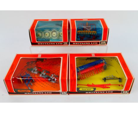 Britains - Four boxed Britains farm implements. Lot consists of Britains #9537 Acrobat Raker; #9543 Buck Rake; #9539 Seed Dri