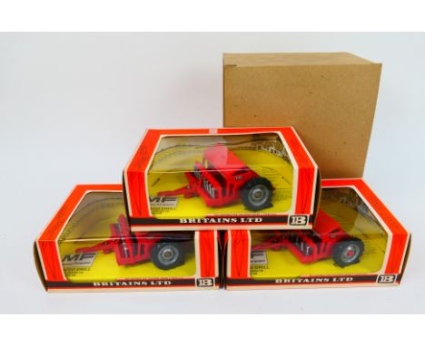 Britains - A trade pack containing a trio of Britains #9577 Seed Drills. The models appear to be in Mint condition, in Mint b