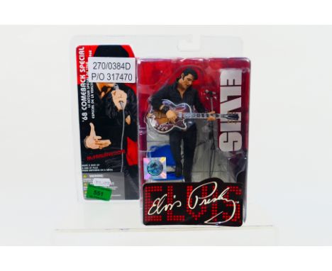 McFarlane Toys - A carded McFarlane Toys 'Elvis - 68 Comeback Special' action figure. The figure with custom stage diorama, a