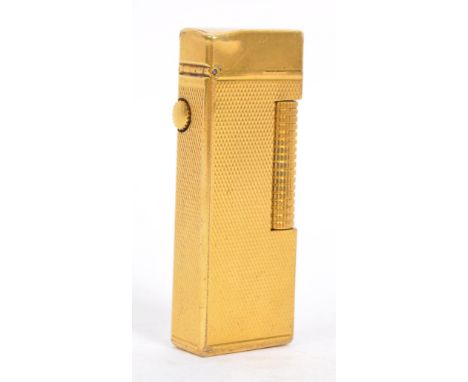 Dunhill - A 20th century Dunhill Swiss made gold plated cigarette lighter. The lighter having engine turned finish. Marked Du