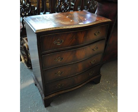 Reproduction mahogany serpentine front chest of four drawers on bracket feet.(B.P. 21% + VAT) 