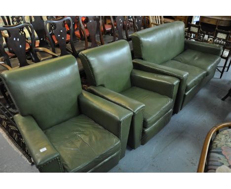 Green leather three piece suite comprising two seater bed settee and a pair of armchairs. (3) (B.P. 21% + VAT) There is no ba