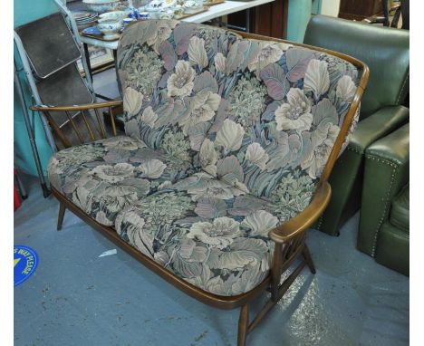 Ercol two seater upholstered sofa with spindle frame and original cushions.(B.P. 21% + VAT) 